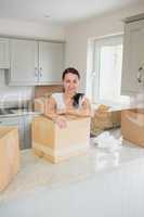 Young woman unpacking in the kitchen