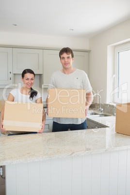 Young couple standing in the kitchen