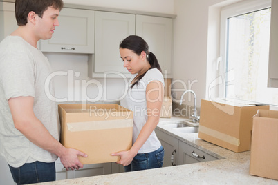 Relocating couple in the kitchen