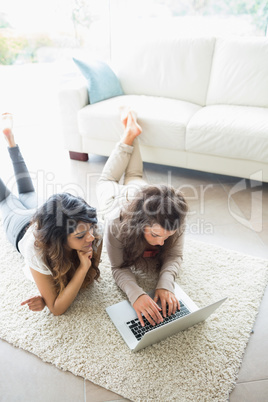 Two women using a laptop