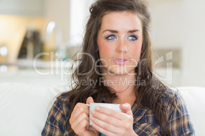 Girl holding a mug with two hands