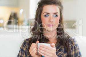 Girl holding a mug with two hands