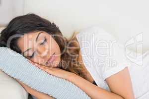 Woman resting her head on a pillow