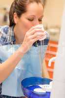 Dental patient woman rinse mouth after treatment