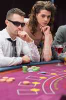 Man and woman at poker table