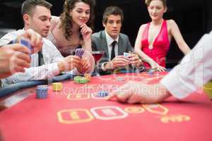 People playing exciting game of poker