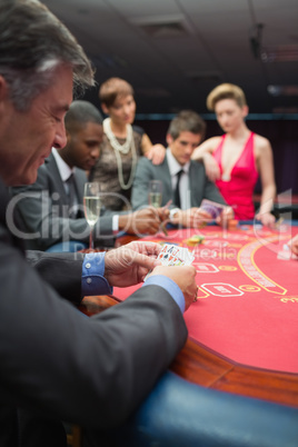 People playing at the poker table