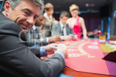 Man smiling at the poker table