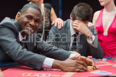 Man smiling while claiming jackpot