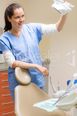 Female dentist prepare patient chair at surgery