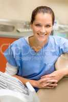 Smiling professional female dentist dental office