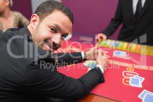 Man looking up from claiming his winnings