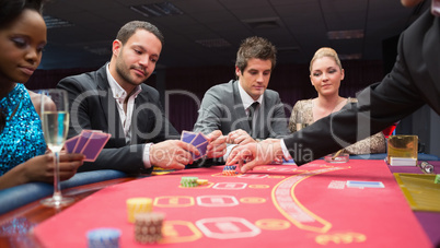 People playing poker at the table