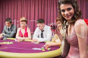 Woman smiling at poker table