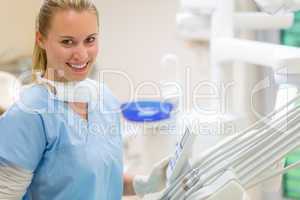 Female dentist with dental equipment at surgery