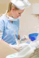 Dental assistant prepare equipment at stomatology