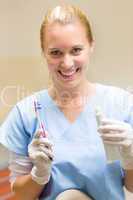 Dental hygienist hold toothbrush and toothpaste