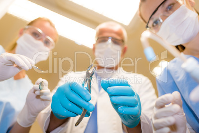 Professional dental team in action bottom view