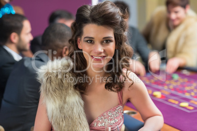 Smiling woman at roulette table