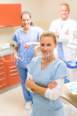 Female dentist with colleagues