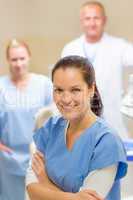Smiling dental hygienist woman with team
