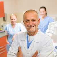 Smiling dental surgeon posing with nurses