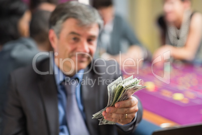 Man holding out money