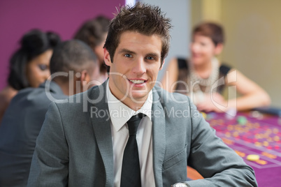 Smiling man at roulette table
