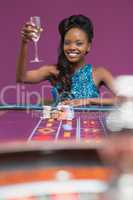 Woman sitting at a roulette table