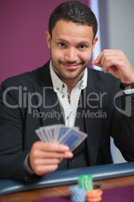 Man holding his cards