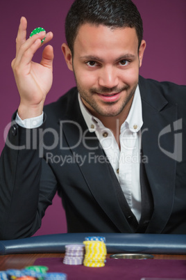 Man holding chip between his fingers