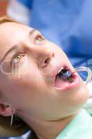 Woman patient at dentist open mouth close-up