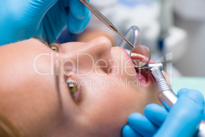 Closeup dental mirror teeth reflection