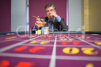 Man sitting at roulette table