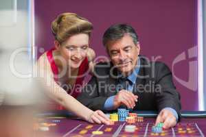 Man and woman placing bets