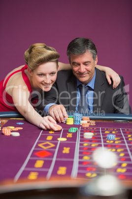 Woman placing bet for man