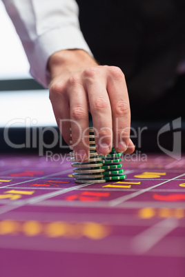 Dealer placing chips on table