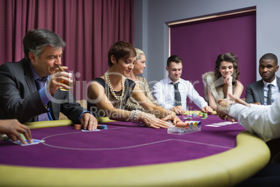 People sitting playing poker