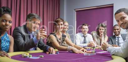Smiling group at poker table