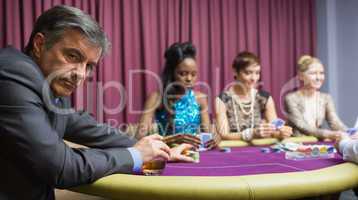 Man sitting at the table at the casino