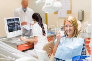 Dental office smiling female patient