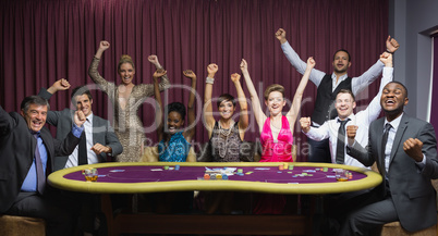 Cheering group at poker table
