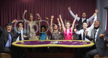 Cheering group at poker table
