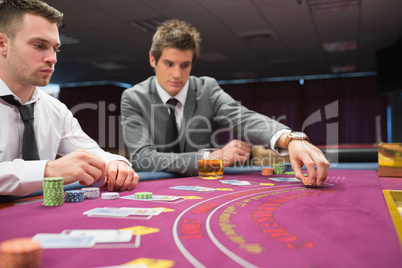 Man placing bet in poker game