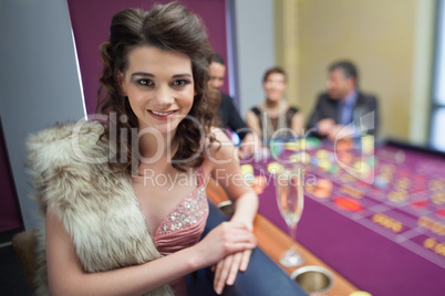 Woman in fur taking break from roulette
