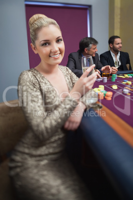 Blonde looking up from roulette table