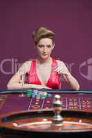 Woman playing roulette with champagne