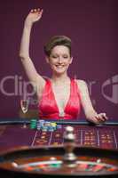 Woman celebrating at roulette