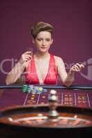 Woman playing roulette alone