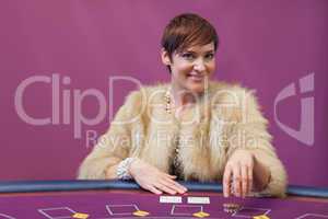 Woman stacking chips in a casino